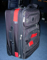Suitcase with red tape markings